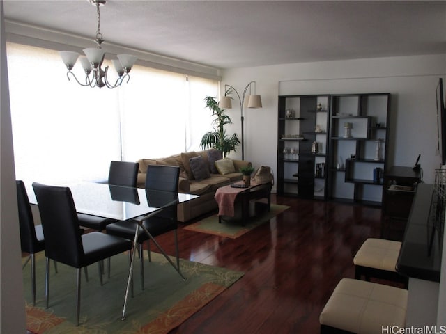 dining area featuring a notable chandelier and hardwood / wood-style floors