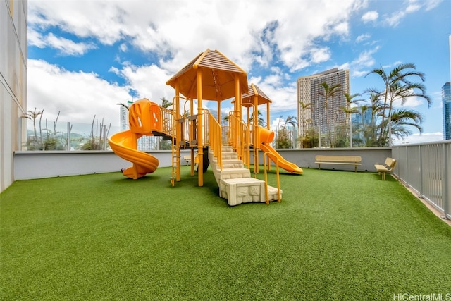 view of playground featuring a yard