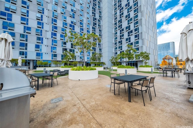 988 Halekauwila St Unit 4209, Honolulu, HI 96814 - view of patio / terrace featuring outdoor dining area and a grill