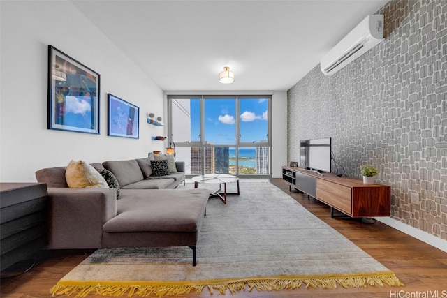 living room featuring an AC wall unit, a wall of windows, and dark hardwood / wood-style flooring