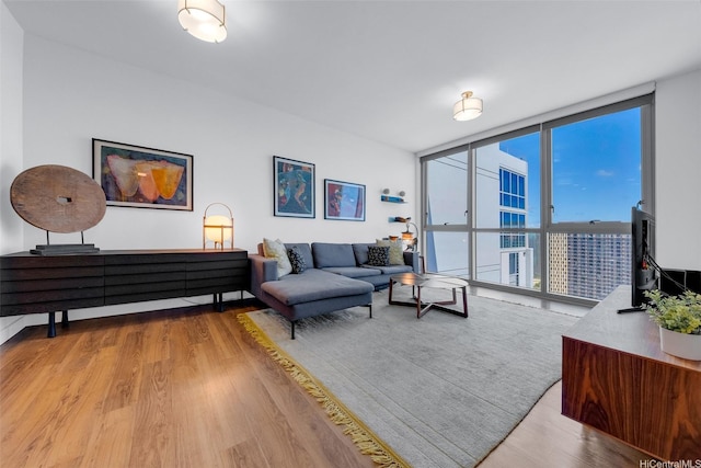 988 Halekauwila St Unit 4209, Honolulu, HI 96814 - living room with expansive windows and light wood-style flooring