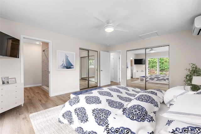 bedroom with ceiling fan, two closets, and light wood-type flooring