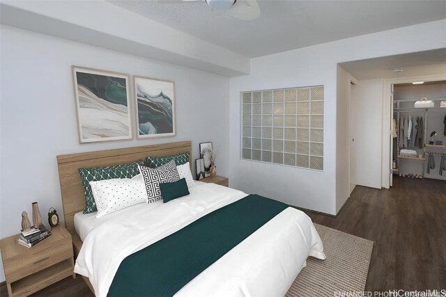 bedroom featuring a closet and dark hardwood / wood-style flooring