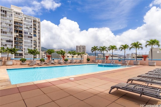 view of pool featuring a hot tub