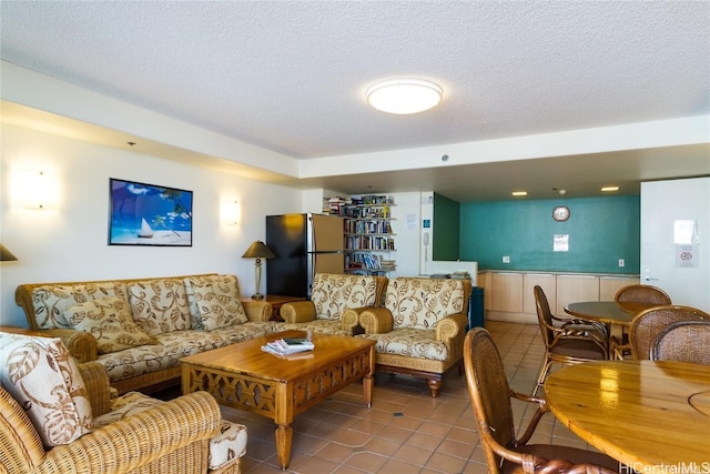 tiled living room with a textured ceiling