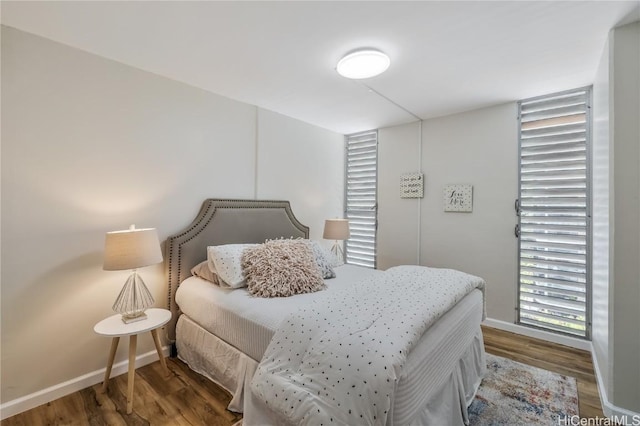 bedroom featuring dark hardwood / wood-style flooring