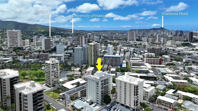 property's view of city with a mountain view