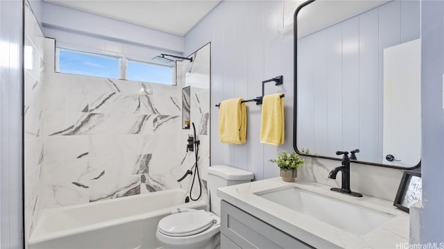 full bathroom with tiled shower / bath combo, toilet, and vanity