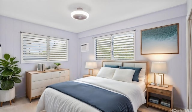 bedroom featuring an AC wall unit