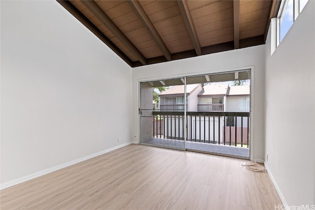 spare room with beamed ceiling, hardwood / wood-style flooring, high vaulted ceiling, and wooden ceiling