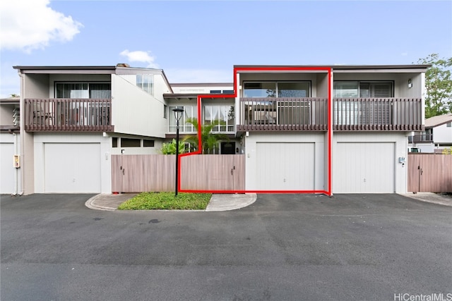 view of front of house with a balcony and a garage