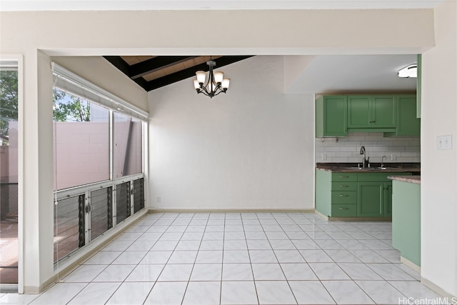 interior space featuring sink, green cabinetry, lofted ceiling with beams, wooden ceiling, and a notable chandelier