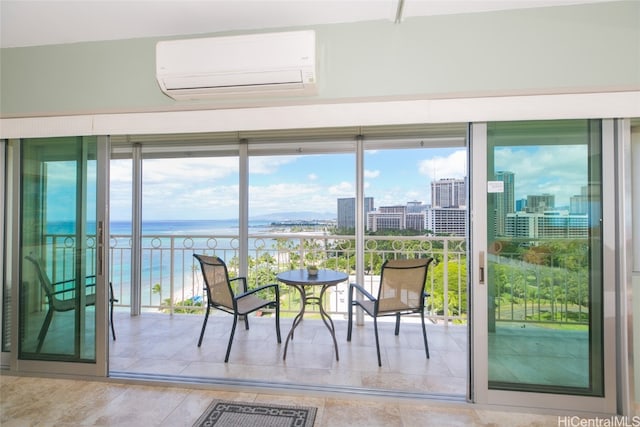 doorway featuring a water view, a healthy amount of sunlight, and a wall mounted air conditioner