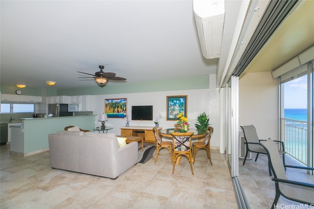 living room featuring sink and ceiling fan