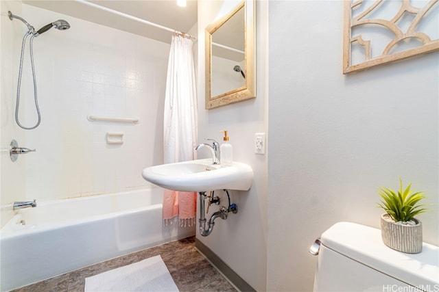 full bathroom with shower / bath combination with curtain, toilet, and sink