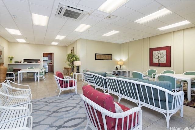 tiled living room with a drop ceiling