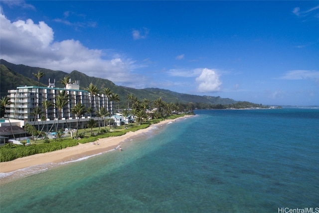 property view of water featuring a mountain view and a view of the beach