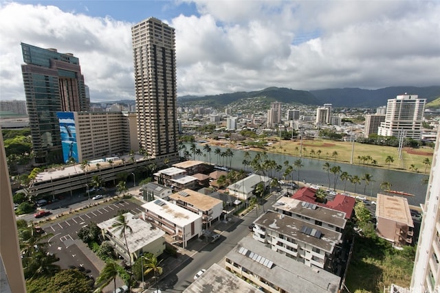 exterior space with a water and mountain view