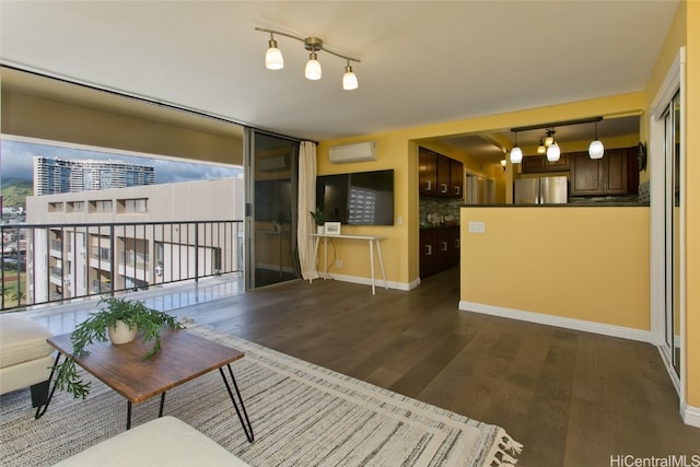 unfurnished living room with a wall mounted air conditioner and dark hardwood / wood-style flooring