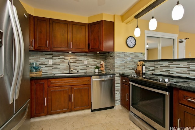 kitchen featuring sink, stainless steel appliances, and tasteful backsplash