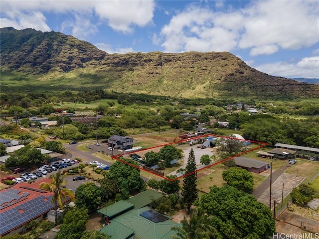 birds eye view of property with a mountain view