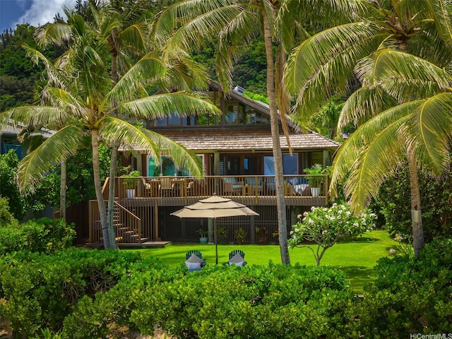 59-557 Ke Iki Rd Unit A, Haleiwa, HI 96712 - rear view of house with stairway, a wooden deck, and a yard