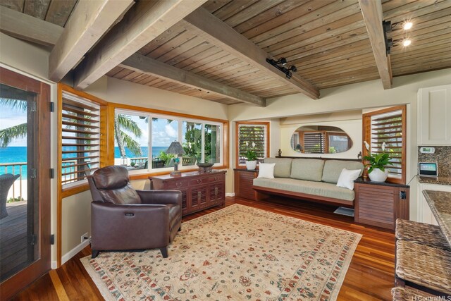59-557 Ke Iki Rd Unit A, Haleiwa, HI 96712 - living room with beamed ceiling, a water view, baseboards, wood ceiling, and wood finished floors