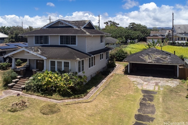 view of front facade featuring a front lawn and a garage