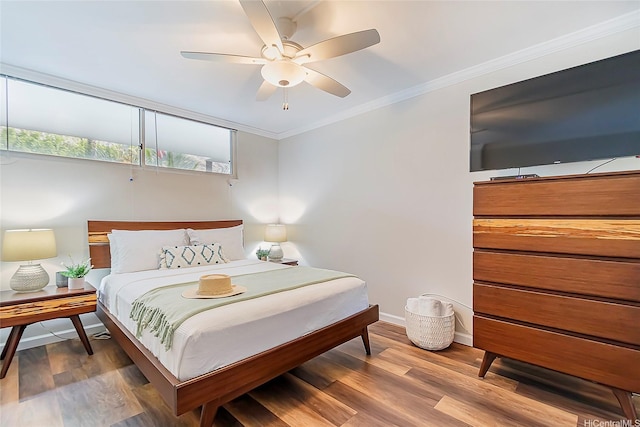 2999 Kalakaua Ave Unit 202, Honolulu, HI 96815 - bedroom with a ceiling fan, baseboards, crown molding, and wood finished floors
