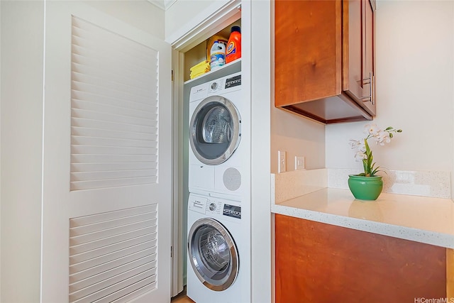 2999 Kalakaua Ave Unit 202, Honolulu, HI 96815 - washroom featuring stacked washer / dryer and laundry area