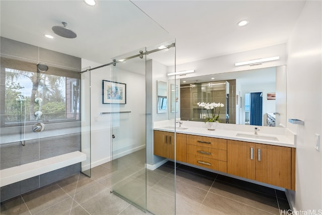 bathroom with vanity, tile patterned flooring, and a shower with door