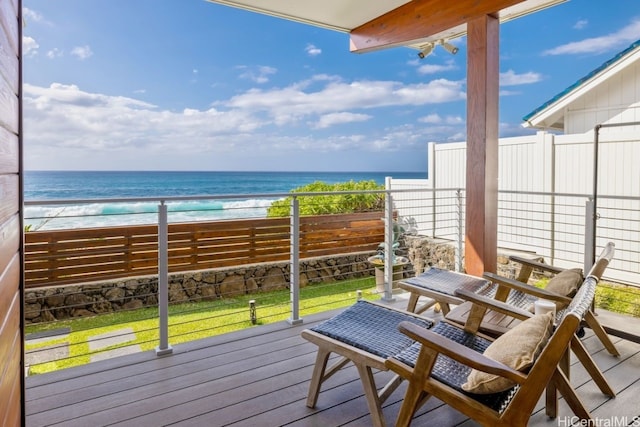 balcony featuring a water view and a view of the beach