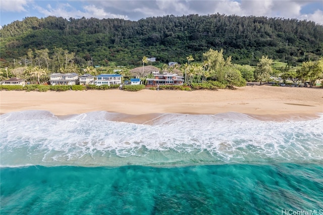 birds eye view of property with a view of the beach and a water view