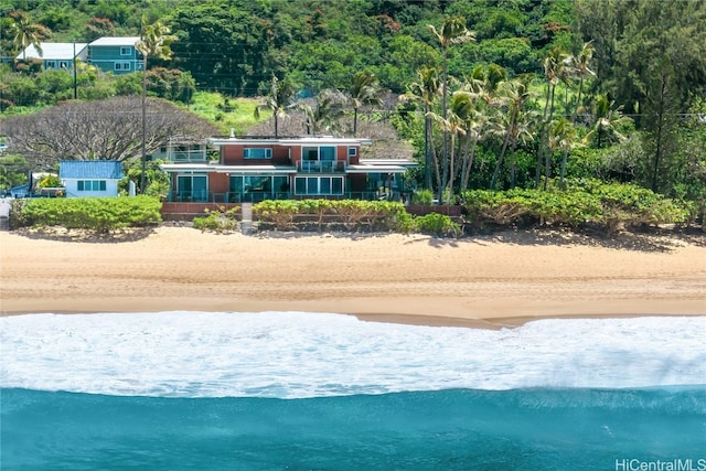 aerial view with a water view and a beach view