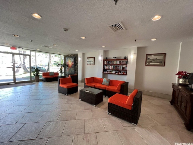 1925 Kalakaua Ave Unit 1206, Honolulu, HI 96815 - building lobby with a wall of windows, recessed lighting, and a textured ceiling