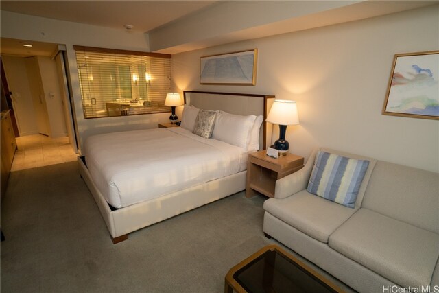 bedroom featuring dark colored carpet