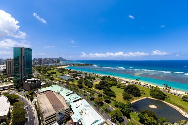 birds eye view of property featuring a water view and a view of the beach