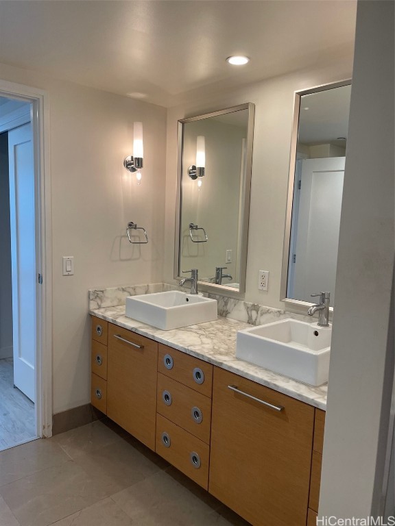 bathroom with vanity and tile patterned flooring