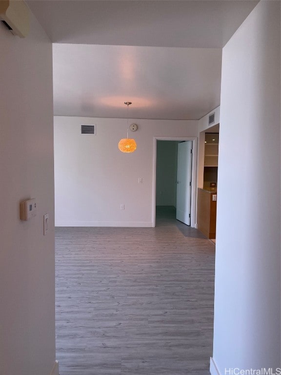 empty room featuring wood-type flooring