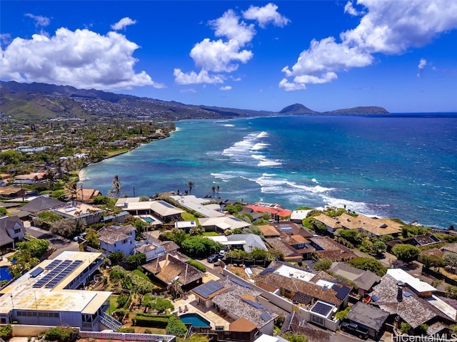 birds eye view of property with a water and mountain view