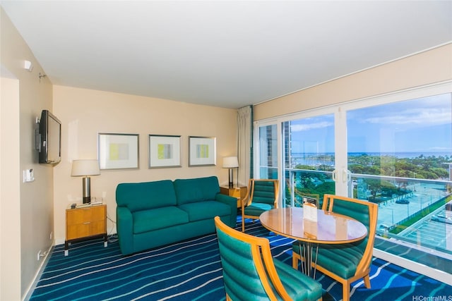 410 Atkinson Dr Unit 907, Honolulu, HI 96814 - carpeted living area featuring baseboards