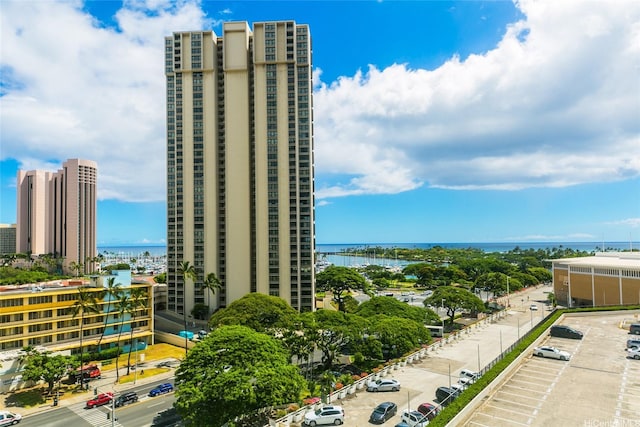 410 Atkinson Dr Unit 907, Honolulu, HI 96814 - view of building exterior with a city view, uncovered parking, and a water view