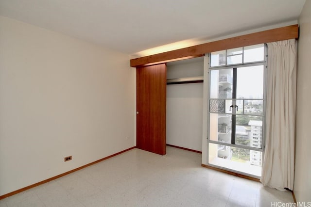 unfurnished bedroom featuring a closet