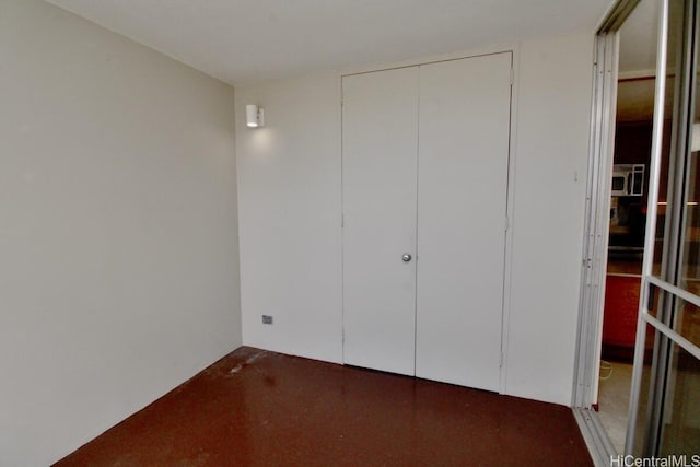 unfurnished bedroom with a closet