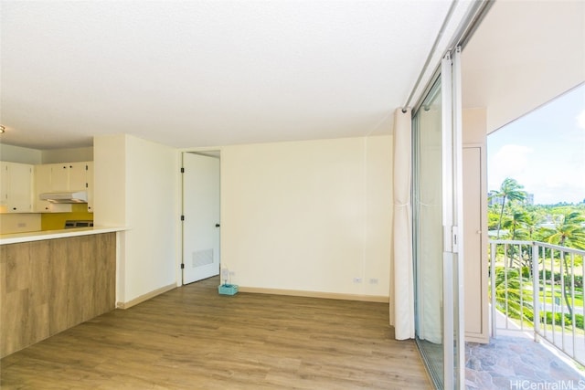 interior space with light hardwood / wood-style flooring and cream cabinets