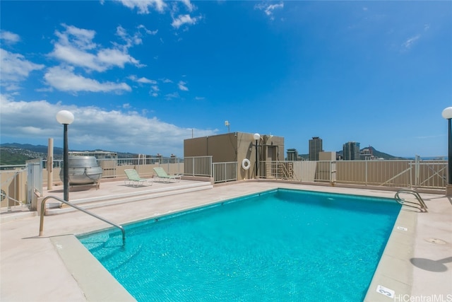 view of swimming pool with a patio area