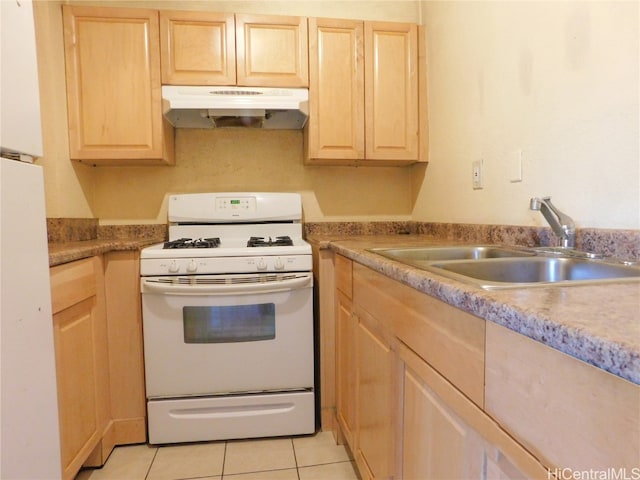 kitchen with white appliances, light tile patterned floors, light brown cabinetry, and sink