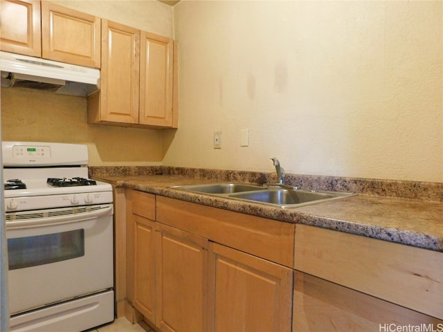 kitchen featuring sink, white range with gas cooktop, and light brown cabinets