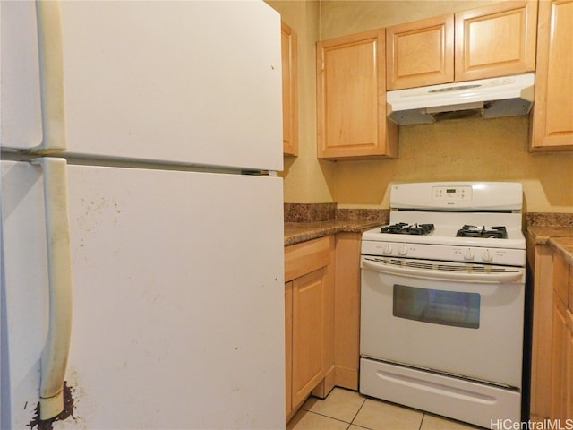 kitchen with light brown cabinets, white appliances, and light tile patterned floors