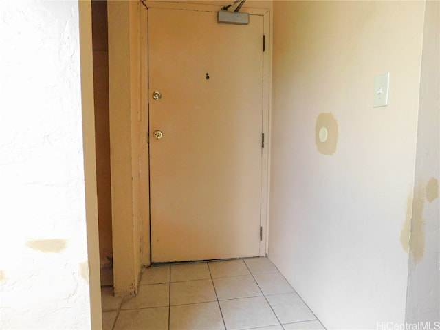 hallway with light tile patterned flooring